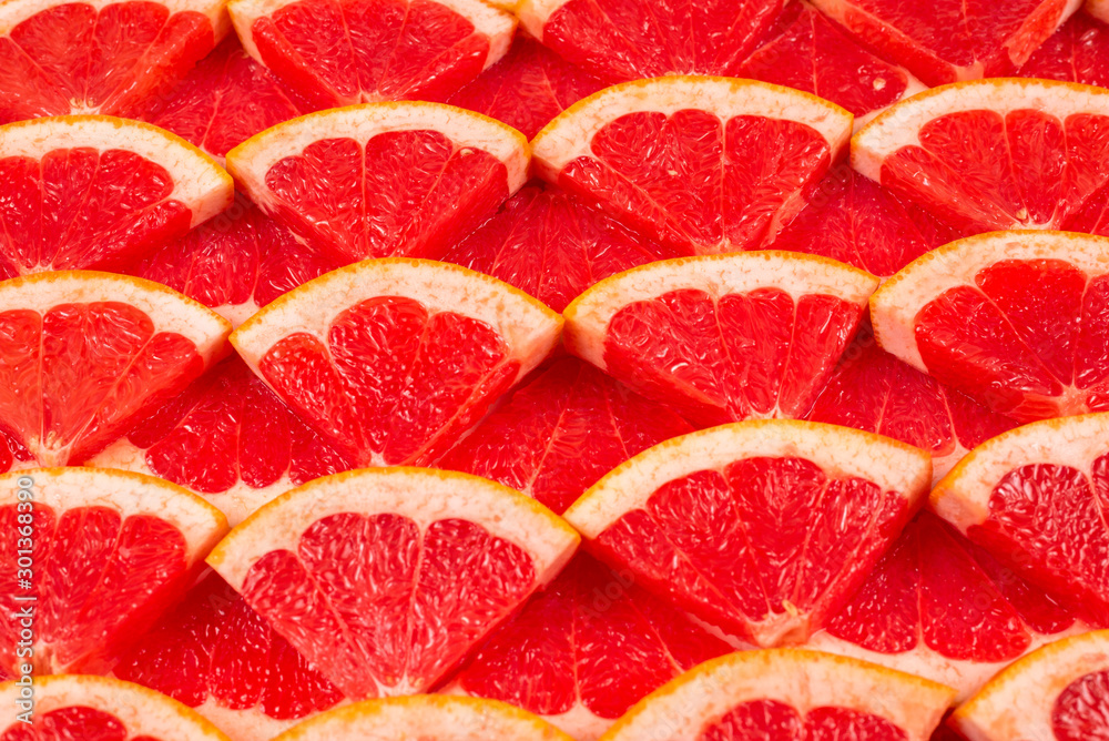 Grapefruit red juicy slices background. top view. Grapefruit red juicy slices background. top view.