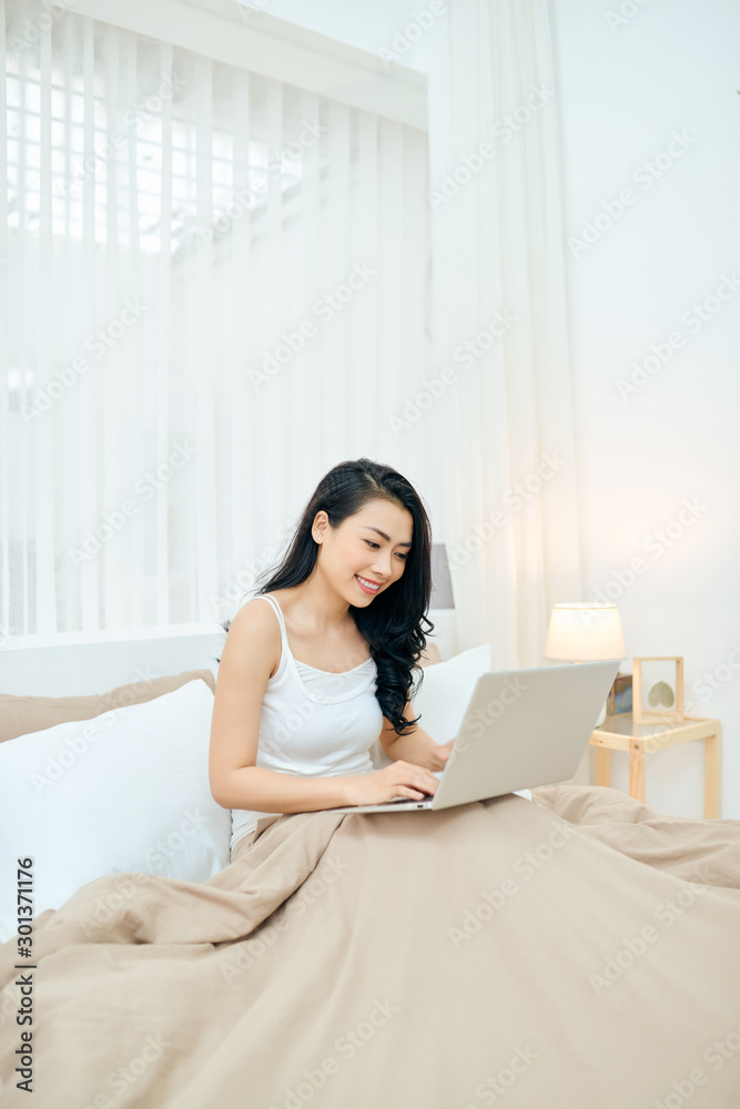 Young Lady smile and happy while write massage in email. Young Lady smile and happy while write massage in email.