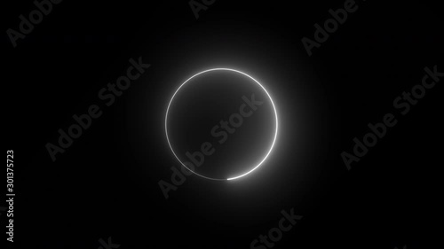 Bright white circle in rotation swirling around glowing on a black background - looped