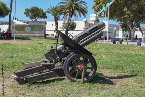 LISBON, PORTUGAL, NOVEMBER 10, 2019: An old iron cannon exposed in a square near the Tagus river in the historic city center of Lisbon. photo