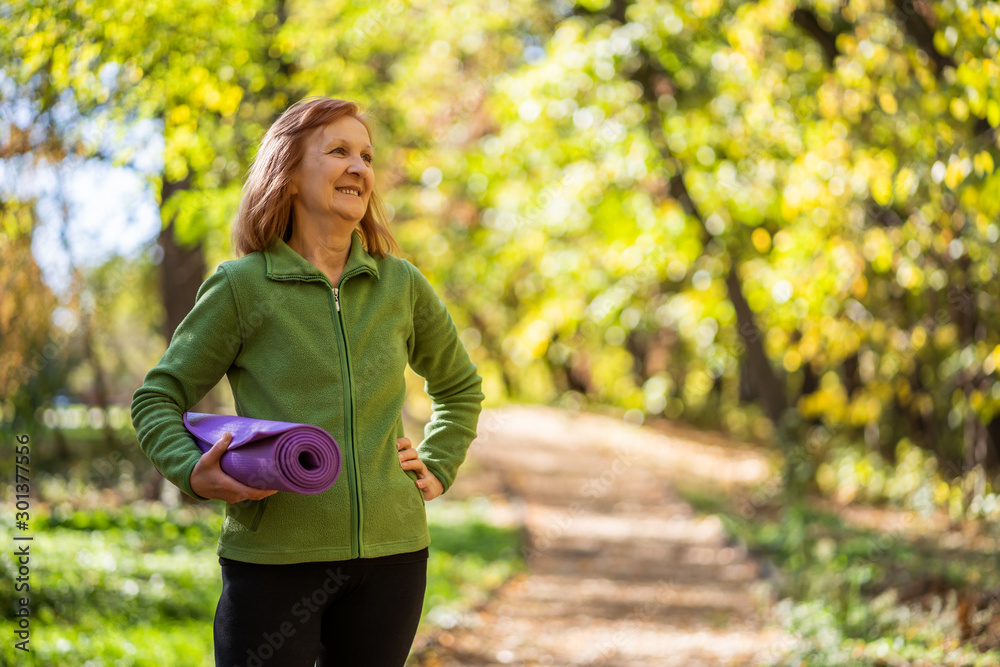 Happy senior woman is ready for exercising in park. Happy senior woman is ready for exercising in park.