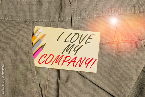 Writing note showing I Love My Company. Business concept for tell why admire their job and workplace Writing equipment and yellow note paper inside pocket of man trousers