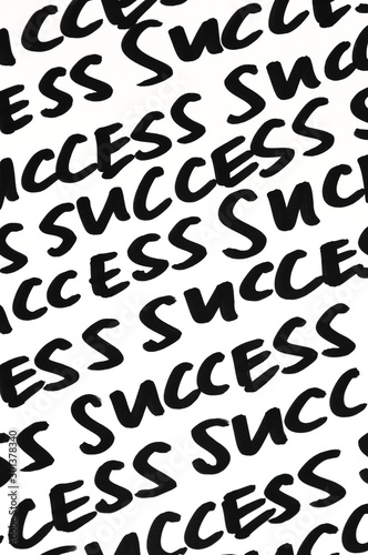 Success message written as a motivational mantra in black ink on white background