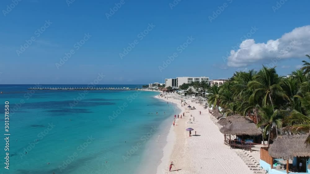 Flying above tropical beach, sea and palms in Mexico Flying above tropical beach, sea and palms in Mexico