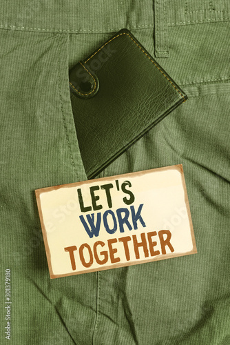 Conceptual hand writing showing Let S Work Together. Concept meaning Unite and Join Forces to Achieve a Common Goal Small wallet inside trouser front pocket near notation paper photo