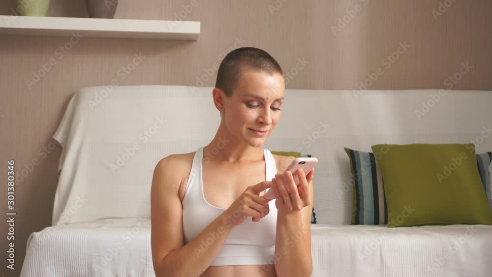 Caucasian american female exercise for lose weight, increase flexibility. Short-haired woman in headphones preparing to exercise