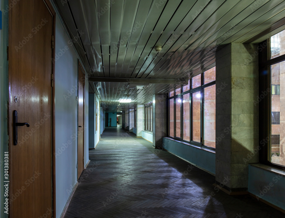  Long dark corridor in an old industrial building