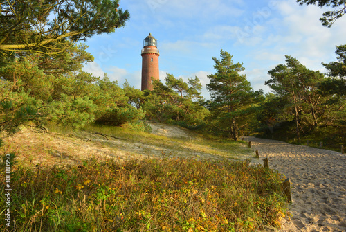 beautiful landscape with the historical Lighthouse at the Darß peninsula in Mecklenburg Germany photo