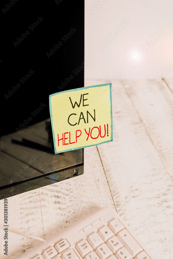 Handwriting text We Can Help You. Conceptual photo offering good assistance to customers or friends Notation paper taped to black computer monitor screen near white keyboard Handwriting text We Can Help You. Conceptual photo offering good assistance to customers or friends Notation paper taped to black computer monitor screen near white keyboard