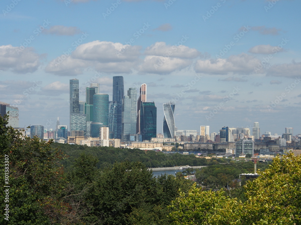 Skyscrapers of the International business center Moscow city against the blue sky and white clouds. 