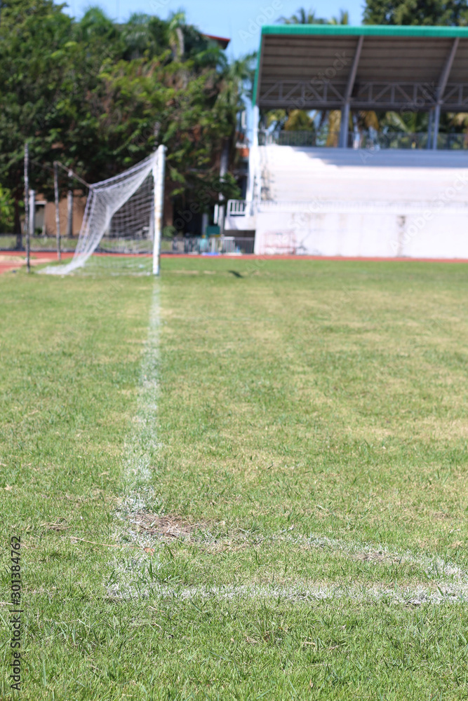 Fototapeta premium White line of corner on the green soccer field.