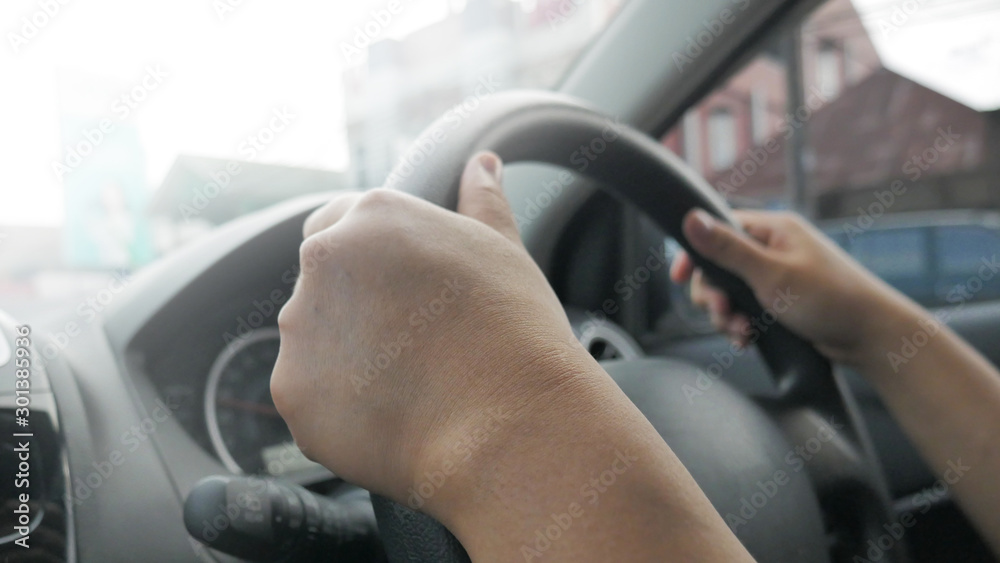 Close up of Hands Driving Car Concept