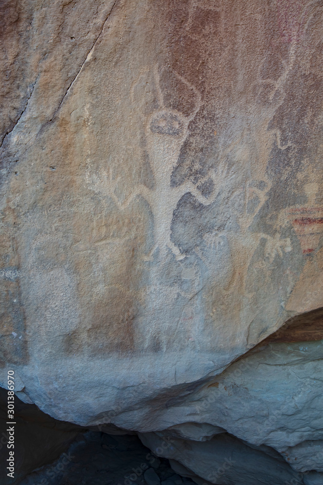 Detail of a part of the petroglyphs incised by the Fremont People in the sandstone rock face at Dinosaur National Monument, Utah