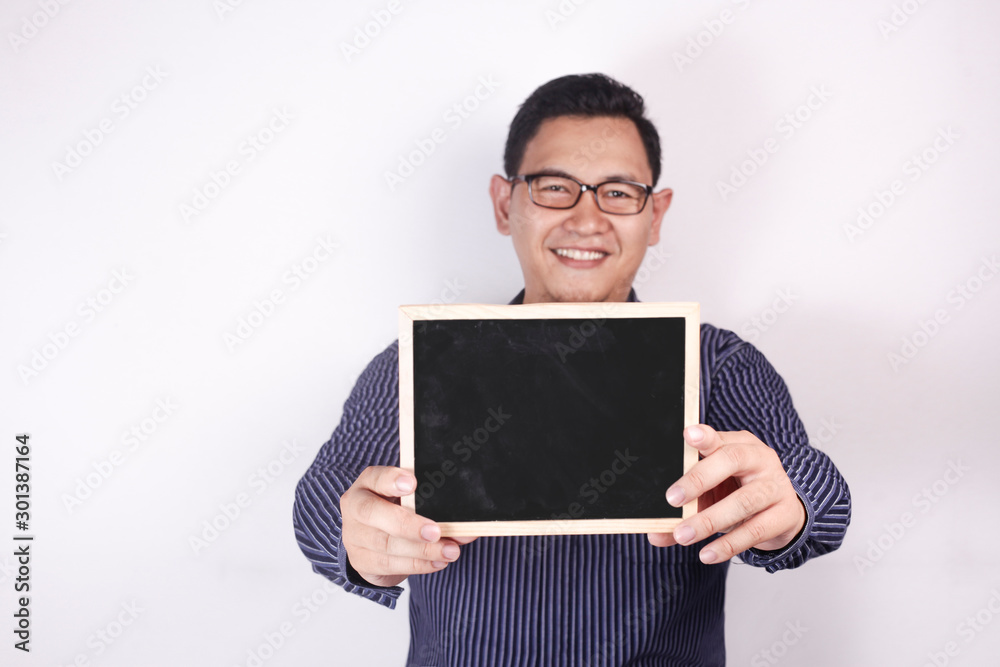 Young Asian Man Smiling and Presenting Empty Copy Space Blackboard Young Asian Man Smiling and Presenting Empty Copy Space Blackboard
