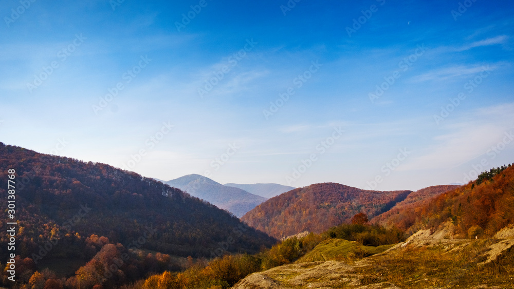 Scenic autumn landscape with mountain peaks