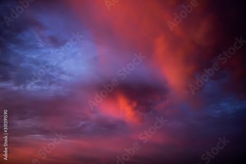 Unusual pink-purple mammatus clouds at sunset. Blurred image for backgrounds. © Galina Atroshchenko