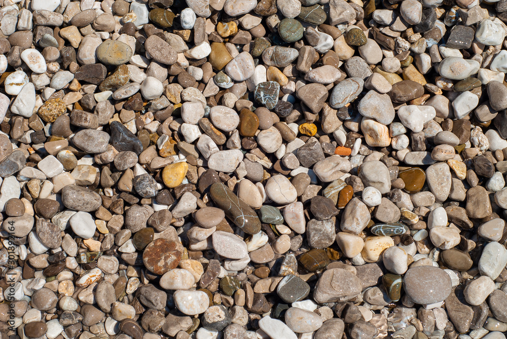 Texture of marine stones eroded by the waters of the sea of various colors and shapes, taken on the beach of Nerano Texture of marine stones eroded by the waters of the sea of various colors and shapes, taken on the beach of Nerano