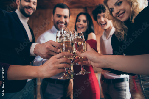 Cropped close-up view of nice attractive trendy elegant cheerful cheery glad positive guys people celebrating clinking glasses congrats at modern industrial loft brick wood style interior indoors