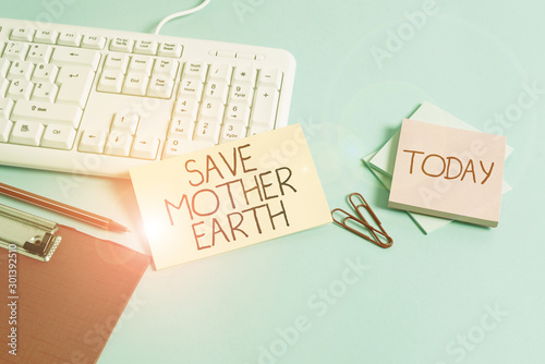 Word writing text Save Mother Earth. Business photo showcasing doing small actions prevent wasting water heat energy Paper blue desk computer keyboard office study notebook chart numbers memo photo
