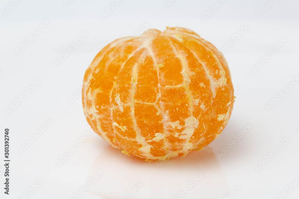 Orange mandarin peeled on a white background Orange mandarin peeled on a white background