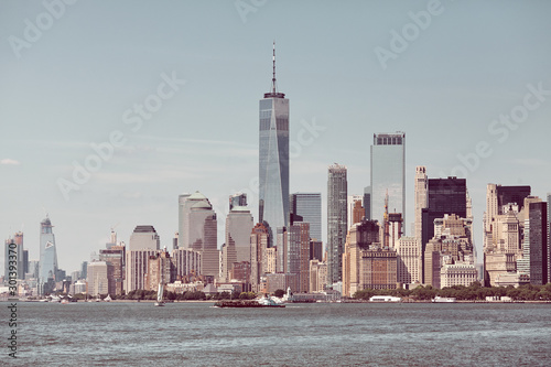 Photography New York City skyline on a sunny day, retro color toning applied, USA