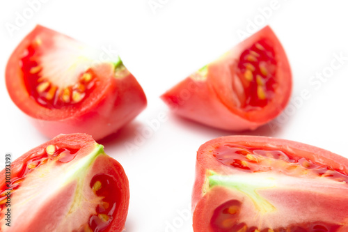 Ripe Pink Quarter Tomato on White Background