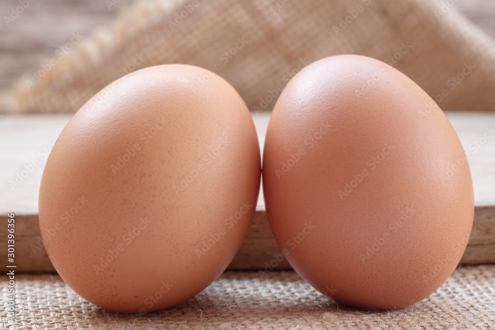 Close up chicken eggs with wooden background Close up chicken eggs with wooden background