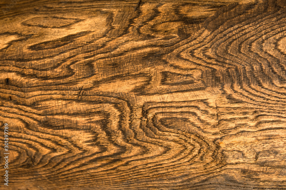 Naklejka premium Wood texture. The wooden surface of the Board with beautiful figure