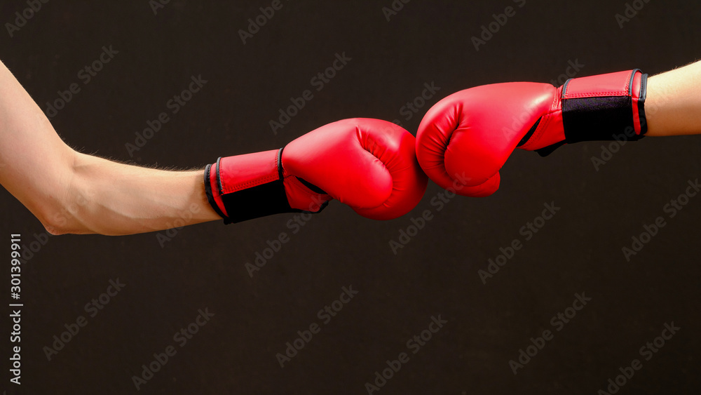 Professional boxer in red boxing gloves. Sport concept
