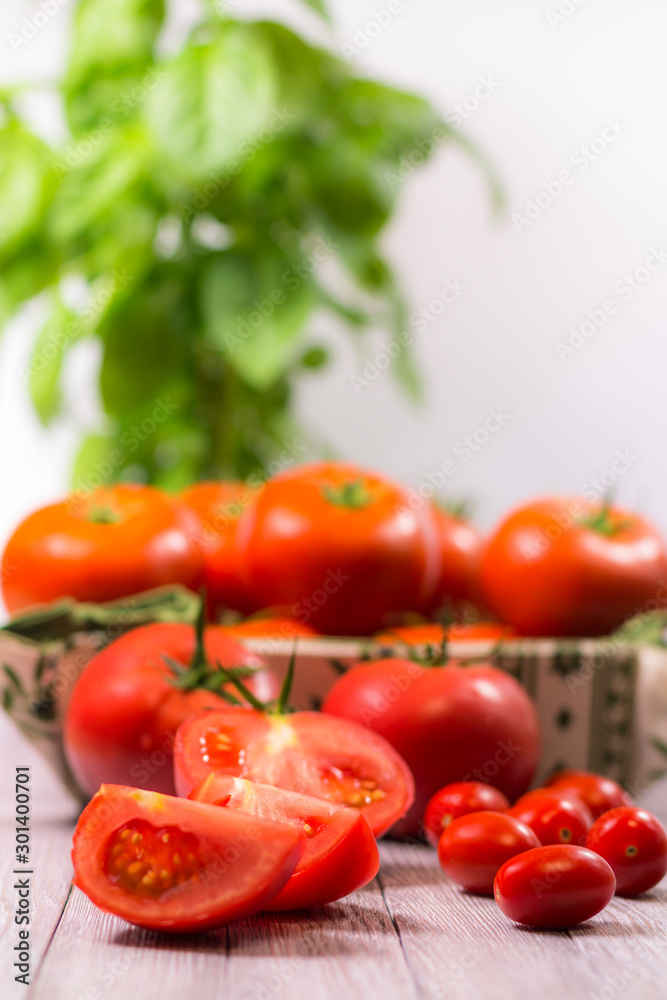 CHERY TOMATOES ON BOARDS WITH SPICES ON WHITE BACKGROUND CHERY TOMATOES ON BOARDS WITH SPICES ON WHITE BACKGROUND