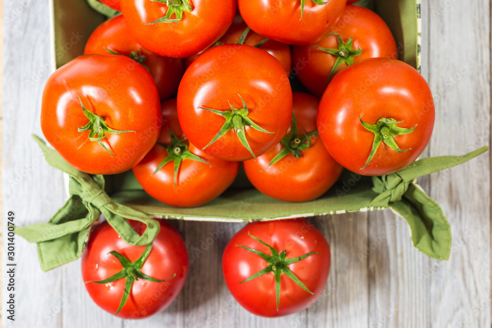 CHERY TOMATOES ON BOARDS WITH SPICES ON WHITE BACKGROUND CHERY TOMATOES ON BOARDS WITH SPICES ON WHITE BACKGROUND