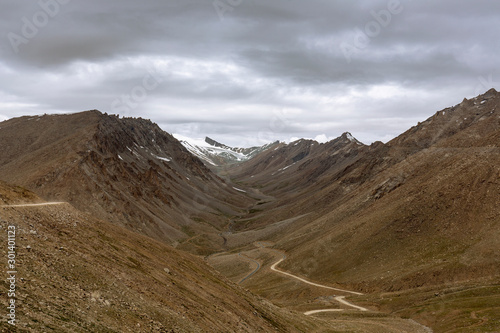 landscape of ladakh in summer with visible snow capped mountain