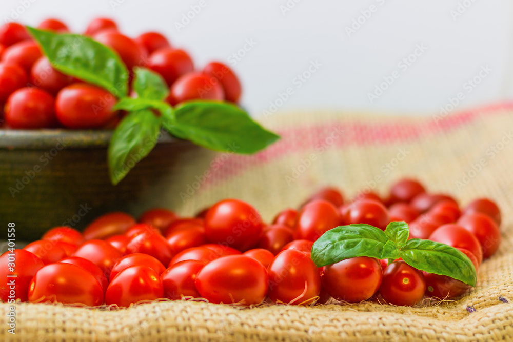 chery tomatoes on a linen sack with spices