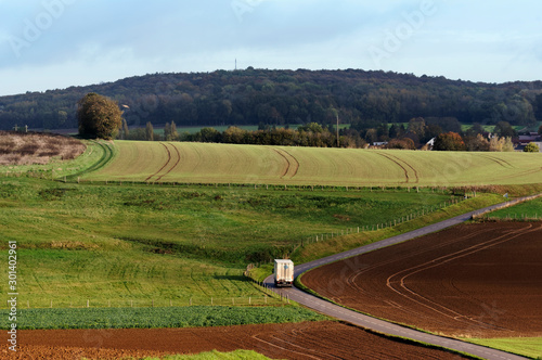 Truck in Country road. French Vexin regional nature park