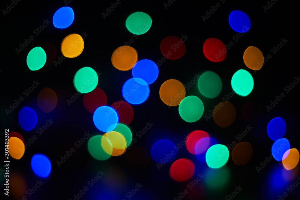 Defocused multi color Christmas light background. Close up