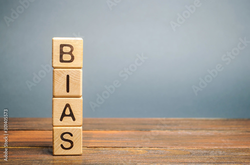 Wooden blocks with the word Bias. Prejudice. Personal opinions. Preconception photo