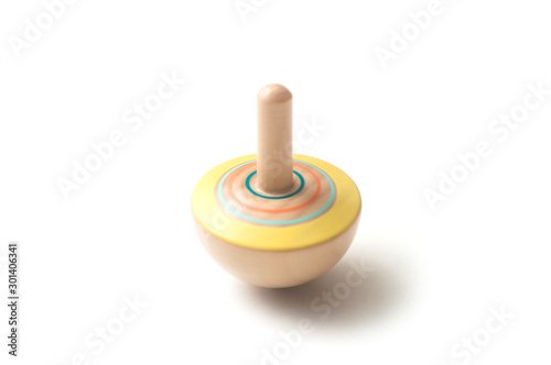 Closeup of wooden whirligig on white background