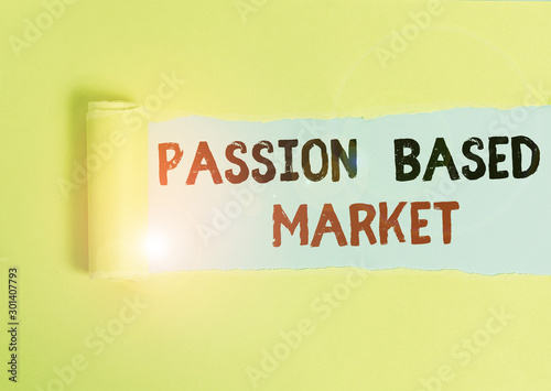 Text sign showing Passion Based Market. Business photo text Emotional Sales Channel a Personalize centric Strategy Cardboard which is torn in the middle placed above a plain table backdrop photo