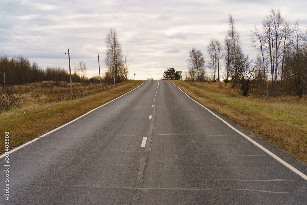 Photography of Russian asphalt road in countryside. Autumn landscape in Moscow region. Concepts of travel mood. Photography of Russian asphalt road in countryside. Autumn landscape in Moscow region. Concepts of travel mood.