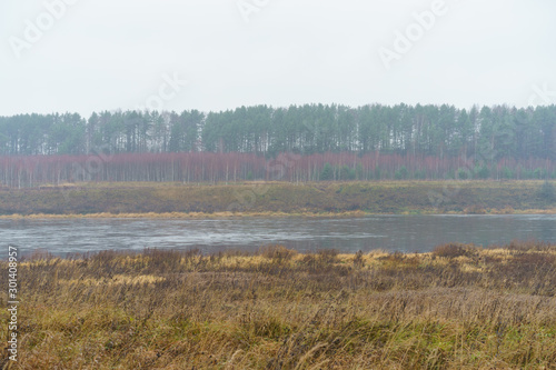 Photography of Russian country side in rainy day. Autumn landscape. Famous Volga river in Tver region. Concepts of travel and touristic mood and beauty of nature in bad wet weather.  