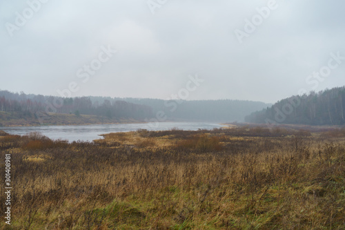 Photography of Russian country side in rainy day. Autumn landscape. Famous Volga river in Tver region. Concepts of travel and touristic mood and beauty of nature in bad wet weather. © Yury and Tanya