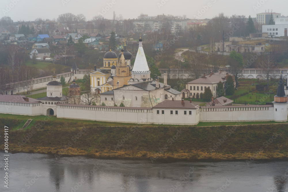 Photography of Staritsky Assumption Monastery on the bank of Volga river. Top view / View from above. Rainy autum day in russian countryside in Tver oblast / region.