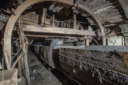 Gold iron mine shaft loading ore to car wagon