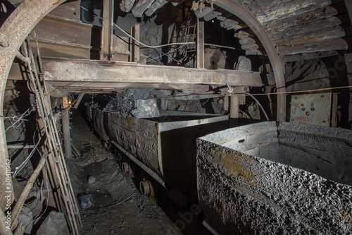 Gold iron mine shaft loading ore to car wagon