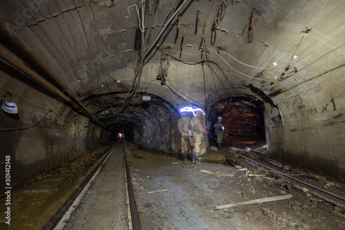 Gold iron mine ore shaft tunnel drift with rails underground © Mishainik