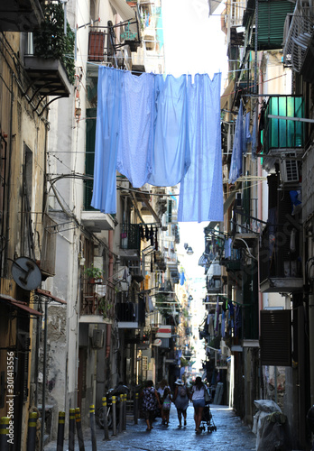 bedclothes on the narrow street in Naples City in Italy