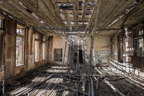 Ruined house with destroyed wood roof