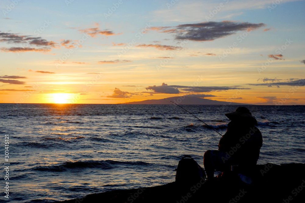 A beautiful sunset at Kihei Beach on the island of Maui, Hawaii.