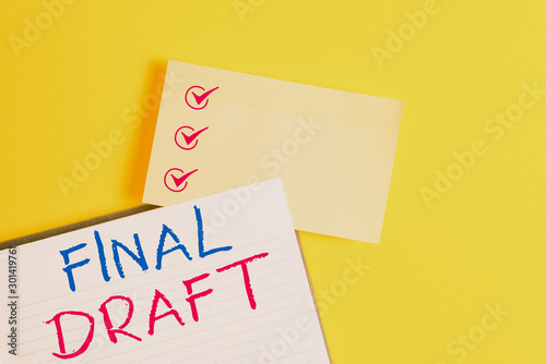 Conceptual hand writing showing Final Draft. Concept meaning final version of something after a lot of editing and rewriting Empty orange paper with copy space on the yellow table