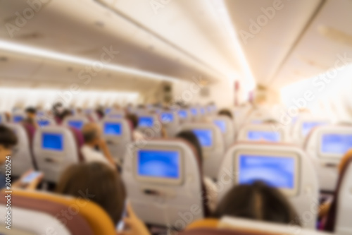 Passengers are sitting inside the plane, blured
